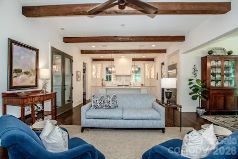 Open floor plan with ceiling beams in the family room and kitchen