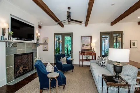 The family room is warmed by a Heat N Glow True 42 gas fireplace