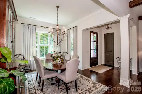 The 8' mahogany front door and pretty entry opens to a cozy dining room
