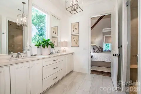 Beautiful flooring and countertops in the expansive primary bath