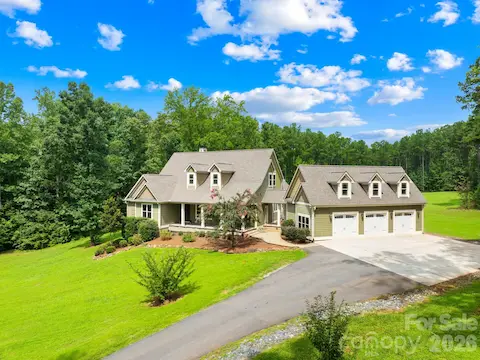 Front view of home showcasing the three car garage