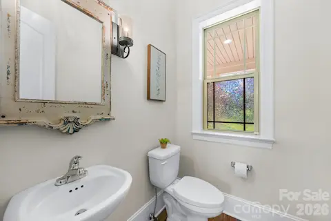 Half bathroom next to mud room