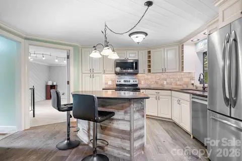 Smart Kitchen with Stainless Steel Appliances that convey