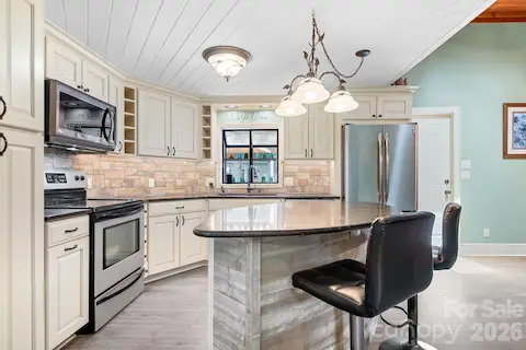 Eat at the breakfast bar if you are on the go. This oversized island is equipped with USB ports