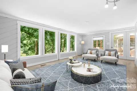 Living room has been redone with painted cedar walls, opens to full deck or kitchen