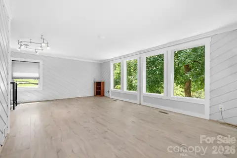 A spiral staircase located in the living room takes you down to the basement