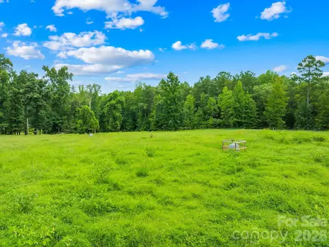 Fenced pasture with established well