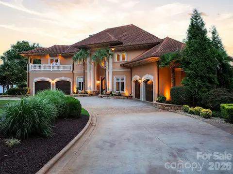Grand motor court and stately exterior provide an impressive arrival to this exceptional waterfront property.