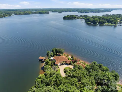 Incredible big-water aerial highlighting the estate’s commanding position on Lake Norman.
