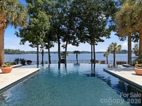 Infinity-edge design creates a striking visual connection between the pool and Lake Norman.