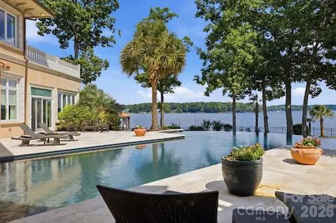 Resort-style pool enjoys a breathtaking backdrop of mature trees and wide-open Lake Norman views.