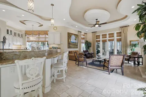 Well-appointed kitchen features extensive cabinetry, multiple work areas and an open, functional layout.