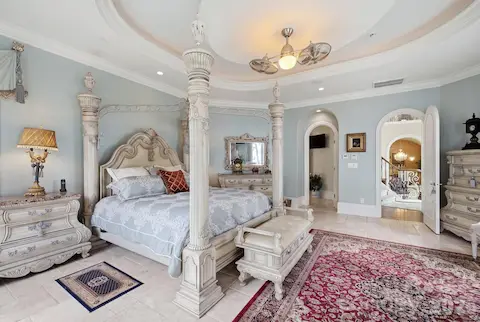 Spacious primary suite offers a peaceful retreat with abundant natural light, elegant finishes and beautiful views of the surrounding property.