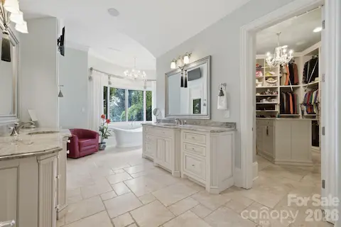 Luxurious primary bath designed with generous space and refined finishes.