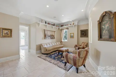 Comfortable sitting area provides additional space to relax and overlooks the main living areas below.