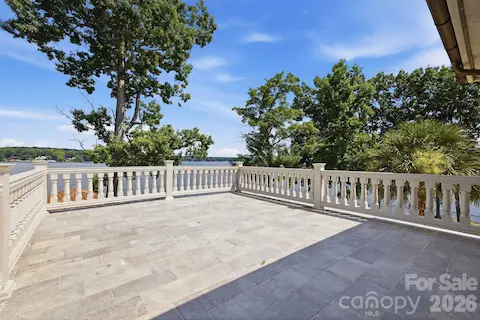 Expansive private balcony off the bedroom offers plenty of space to relax and enjoy the surrounding lake views.