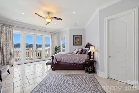 Spacious bedroom features a comfortable sitting area, creating extra space to relax and unwind.