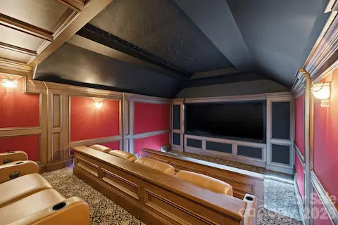 Dedicated theater room on the upper level provides a comfortable space for movies and entertainment.