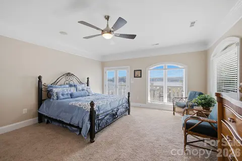 One of two guest house bedrooms, featuring a private ensuite bath for added comfort and privacy.