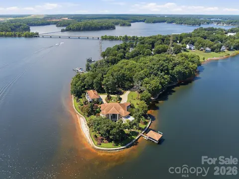 Rear aerial showcases the property’s incredible waterfront setting with over 1,700 feet of Lake Norman shoreline.