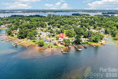 Aerial view looking north.  Water surrounds this amazing home and location.
