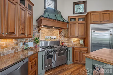 Custom patina-finished range hood.