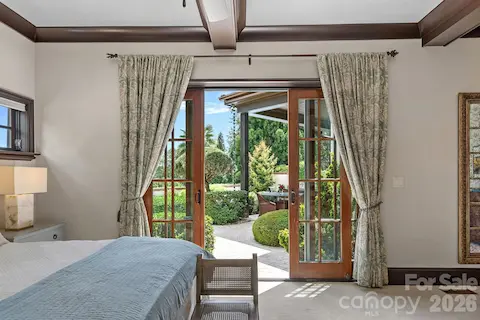 Primary suite opens to outdoor living area.