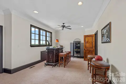 Spacious multi-use area on the upper level with beautiful views of the neighboring pond.
