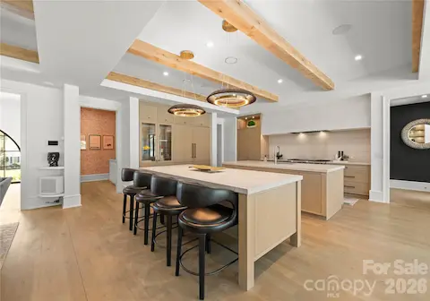 Kitchen with 2 large islands, custom cabinetry.