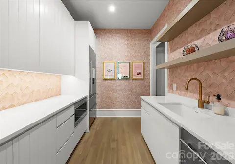 Fully equipped scullery with second sink and dishwasher, full size Sub-Zero fridge/freezer, Wolf drawer microwave, and pantry.