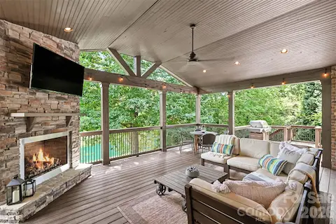 Impressive covered outdoor retreat w/ Stone Fireplace