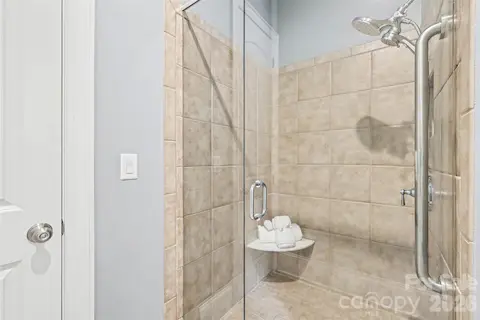 Frameless glass shower with Tile surround