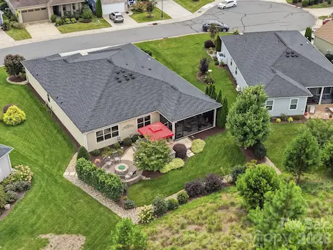 A bird's-eye view reveals the beautiful landscaping, hardscaping and outdoor living spaces waiting out back.