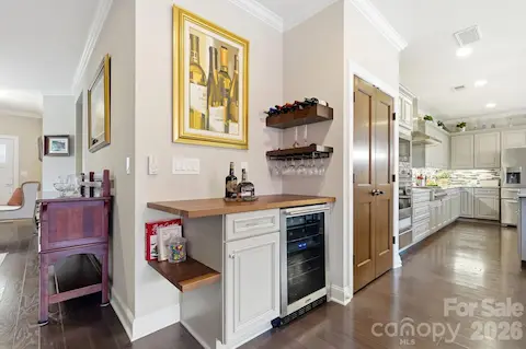 A dedicated bar with wine refrigerator makes everything from morning coffee to happy hour easy.