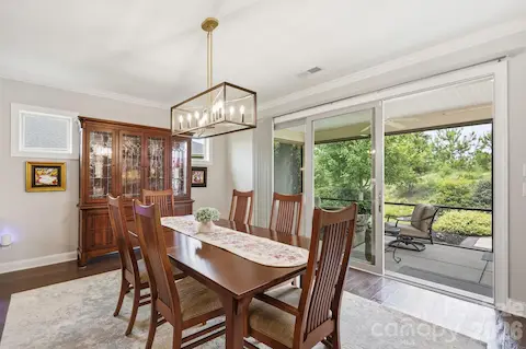 Dining with a view...the open layout connects beautifully with a rolling wall to the outdoor living spaces beyond.