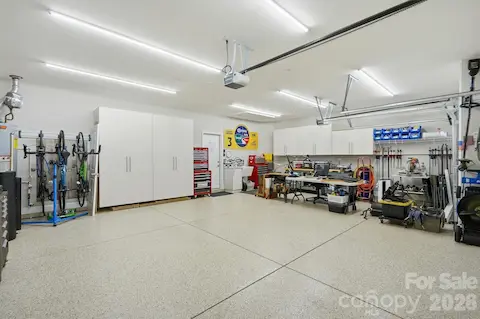 The extended, insulated garage is an upgrade all its own with poly-coated floors, cabinetry, utility sink and LED lighting.