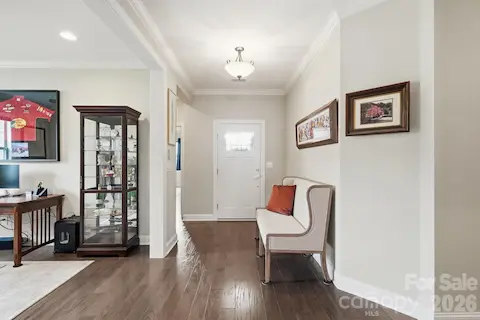 A gracious foyer introduces the home's warm hardwood floors and easy-flowing one-level design.