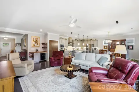 A wider view shows just how beautifully the great room flows into the kitchen and dining spaces.