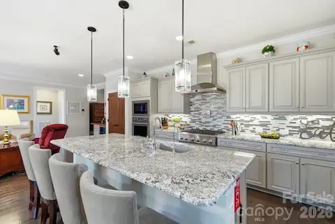 The oversized island takes center stage with plenty of room for meal prep, casual dining and conversation.