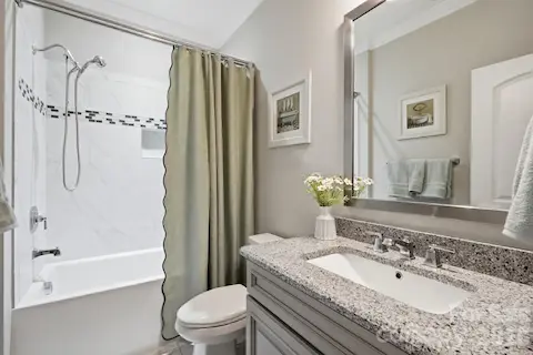 Full secondary bath continues the home's cohesive finishes and attention to detail.