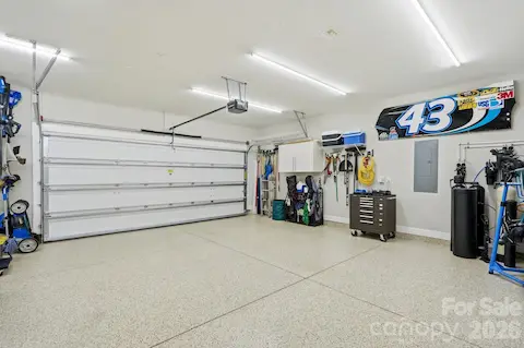 The oversized garage offers exceptional usable space plus dedicated golf cart storage.