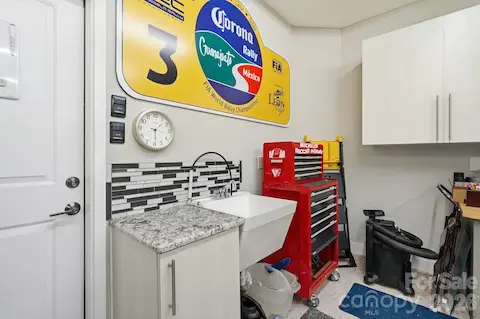 Even the garage received extra attention with cabinetry, utility sink and additional storage/work space.