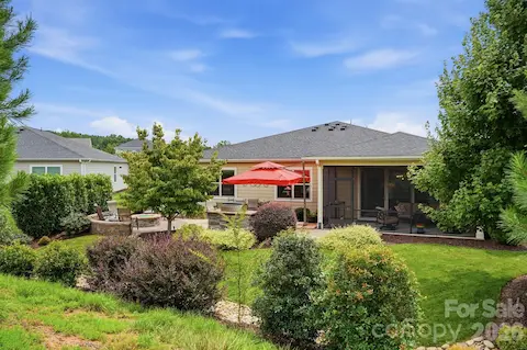 Lush landscaping surrounds the backyard retreat, creating color, texture and privacy.