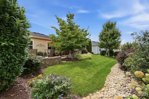 Thoughtful hardscaping and landscaping turn the backyard into a peaceful retreat rather than simply a yard.
