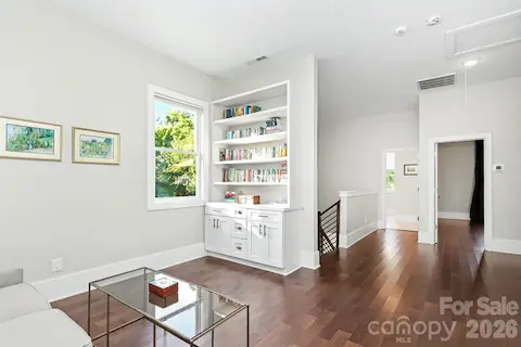 Second floor loft area with built ins and access to laundry