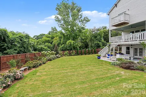 Flat private rear yard that is beautifully landscaped and a possibility for a pool