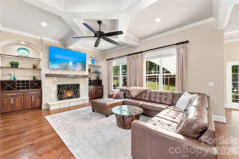 Great room with coffered ceiling and built-ins