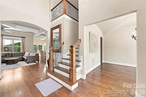 Entry looking into great room and formal dining room site finished hardwoods are throughout the home.
