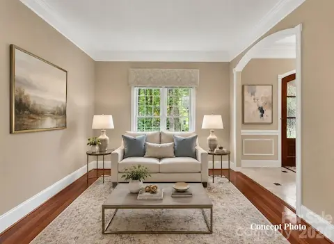 Concept photo of virtually staged living room features rich hardwood floors, abundant natural light, and an open flow ideal for both everyday living and entertaining.