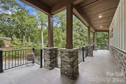 Generous covered porch extending the home’s living space outdoors